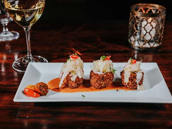 crab cakes with blood orange crab sauce, fennel apple slaw